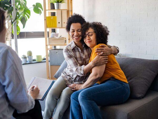 Women hugging at doctor's office