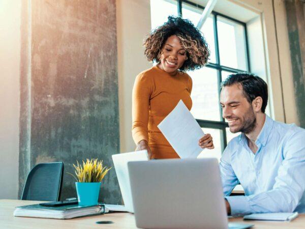 Man and woman in front of computer