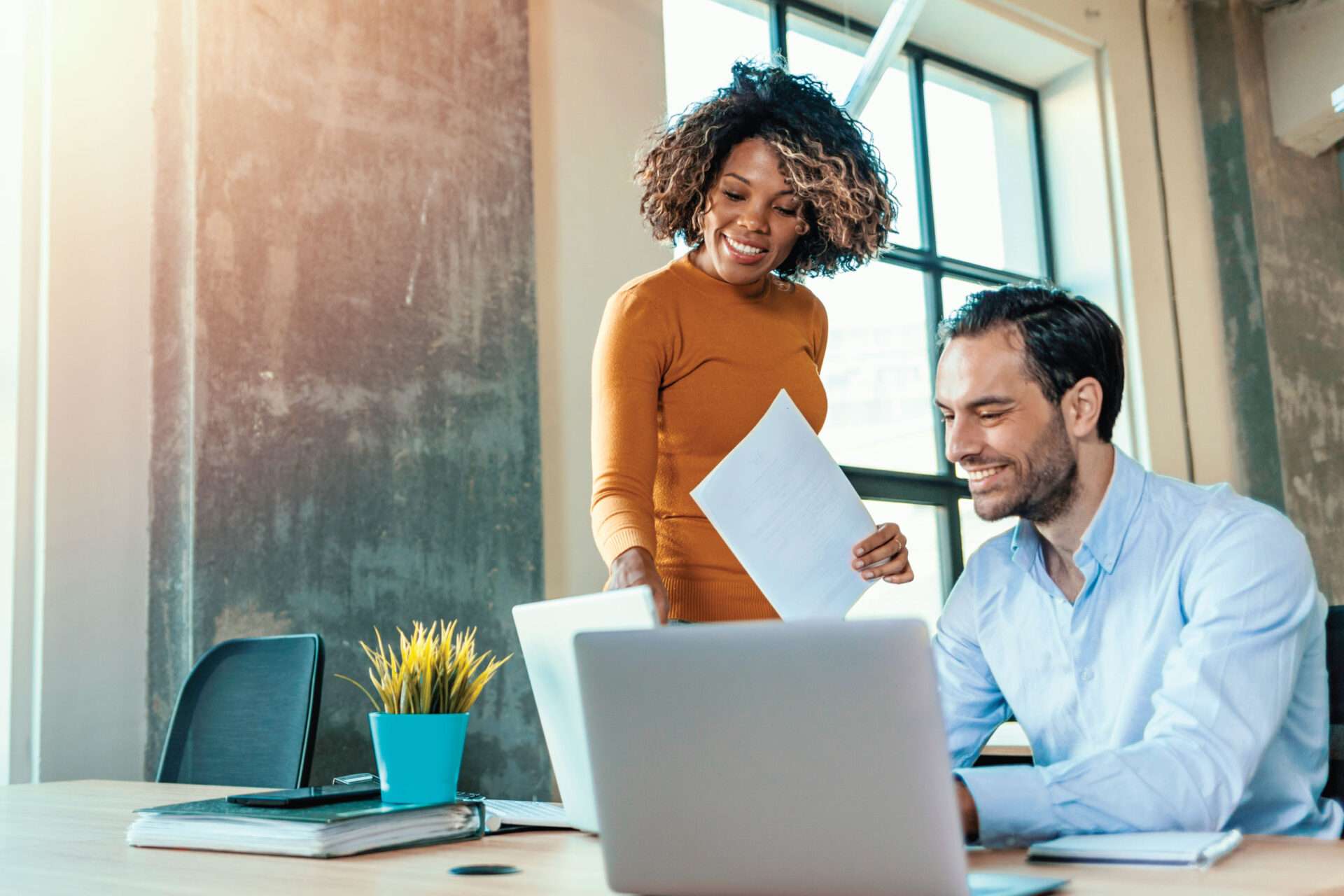 Man and woman in front of computer